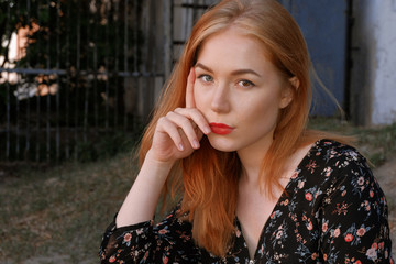 Pensive girl in boho style wear looking in camera