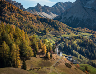 Alpine panorama with a small church in the Italian Dolomites