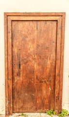 Fototapeta na wymiar Wooden door, of a semi-abandoned house