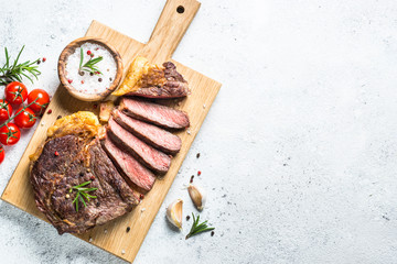 Grilled beef steak ribeye on white. 