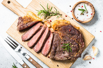 Grilled beef steak ribeye on white. 