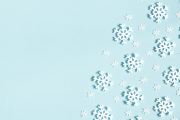 Christmas or winter composition. Pattern made of snowflakes on pastel blue background. Christmas, winter, new year concept. Flat lay, top view, copy space