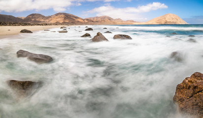 White water and sands at "Playa Blanca" beach in Pan de Azucar National Park, North Chile with the amazing Atacama Desert sands ending on the Pacific Ocean waters, maybe the best beaches in Chile