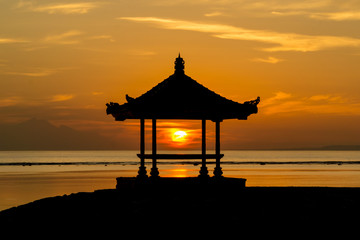 Silhouette of a small pavilion during sunrise