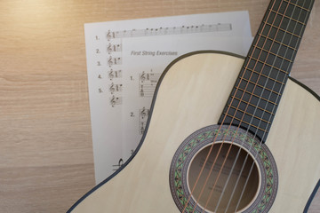 Guitar image with sun light and notes