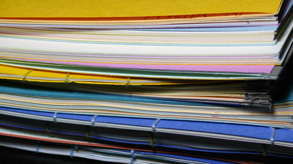Stack of handmade books with colorful covers