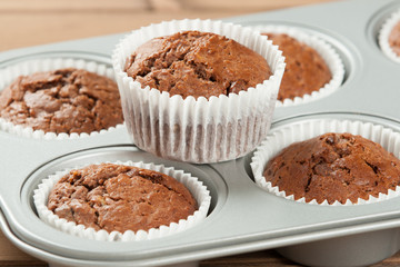 Homebaked Muffins With Chocolate, Banana, Coconut In Baking Tray.