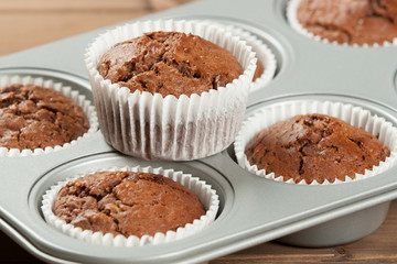 Homebaked Muffins With Chocolate, Banana, Coconut In Baking Tray.