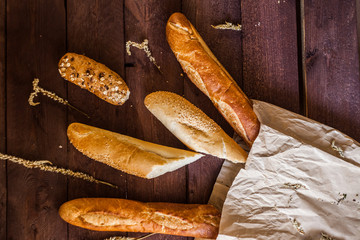 different types of bread on a wooden table