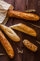 different types of bread on a wooden table