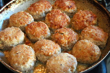 Cooking meat patties in a pan. Close-up. Background.