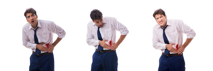 Wounded businessman with blood stains isolated on white backgrou
