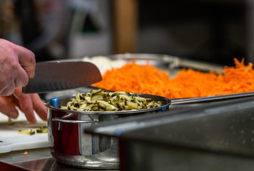 Female Chef Chopping Pickled Cucumbers for Salads, Wedding Meal