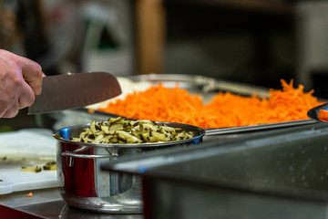 Female Chef Chopping Pickled Cucumbers for Salads, Wedding Meal