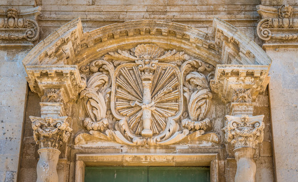 Detail from the facade of the Church of Santa Lucia alla Badia in Siracusa old town (Ortigia). Sicily, southern Italy.