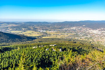 Aerial view of Liberec city and Jizera Mountains from Jested Mountain on sunny summer evening. Czech Republic.