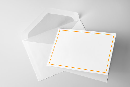 Blank stationery: greeting card with gold frame and envelope