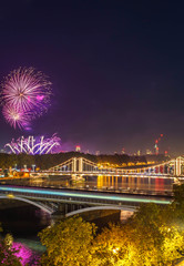 High Resolution Panorama of the Chelsea Bridge in London from Battersea Park at night and the fireworks 