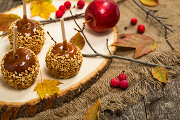 Caramel Apples on Wooden Background. Selective focus.
