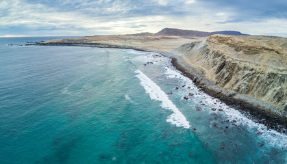 An aerial view of Atacama Desert at the coastal area at Chorrillos beach (Bahia Inglesa) an amazing landscape for geology with incredible sand formations and folds in the Earth, Copiapo, Chile
