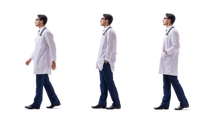 Obraz premium Young doctor physician standing walking isolated on white backgr