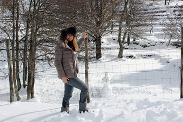 Young siberian girl and winter landscape