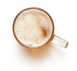 top view of mug of beer isolated on white background