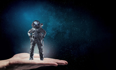 Obraz na płótnie Canvas Astronaut on his mission. Mixed media
