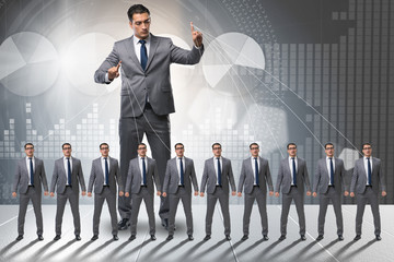 Boss employee manipulating his staff in business concept