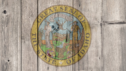 USA Politics News Concept: US State Idaho Seal Wooden Fence Background