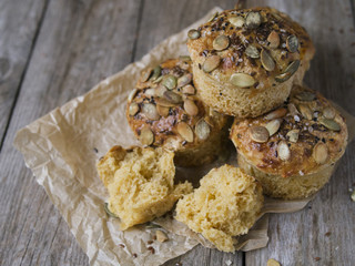 Homemade Autumn Pumpkin Muffins with cheese, paprika and sea salt ready to eat on wooden background. Copy space, close up, selective focus