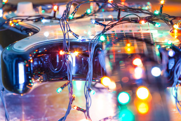 bright colorful festive lights of a garland around an electric guitar