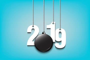 2019 New Year and hockey puck hanging on strings