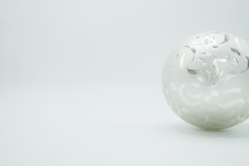White Christmas ball on white background. Left copy space.