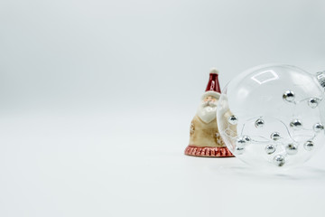 Transparent christmas ball with silver spheres and Santa Claus.