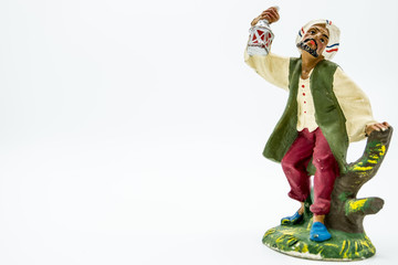 Christian nativity scene figure isolated on white. Background of Man with a lamp in his hand.