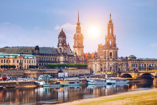 Incredible evening panorama of Cathedral of the Holy Trinity or Hofkirche, Bruehl's Terrace or The Balcony of Europe. Dramatic autumn sunset on Elbe river in Dresden, Saxony, Germany, Europe.