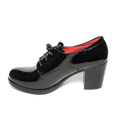 Women's platform black shoes isolated on white background colored