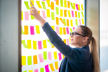 Beautiful female employee with many conflicting priorities 