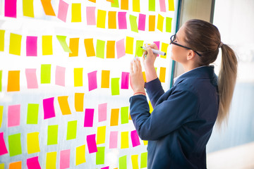 Beautiful female employee with many conflicting priorities 