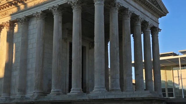 Nîme,Gard, Occitanie, France. The roman house named Maison Carrée. The roman temple is dated about 4-7 AD, in the background, the Carree d'Art by Norman Foster inaugurated in 1993.