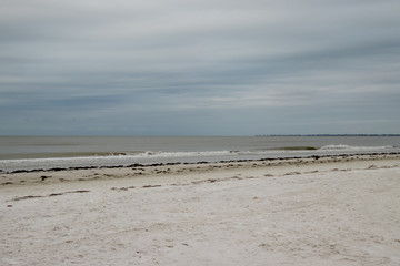 View of Fort Myers beach on Estero Island in Florida on stormy morning.