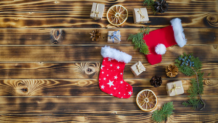 Christmas composition. Christmas consept. Flat lay, top view. Christmas socks for gifts, fir cones,...