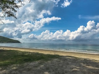 Beautiful tropical beach sea and sand in sunshine on summertime with blue sky and clouds backgrounds.