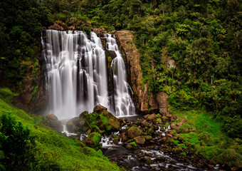 Fototapeta na wymiar waterfall in a green valley