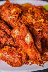 Hot and crispy fried chicken legs, thai style.