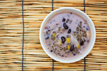 Sago and black beans in coconut cream with young coconut, Thai dessert.