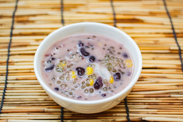 Sago and black beans in coconut cream with young coconut, Thai dessert.