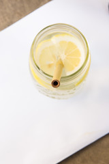 Lemon water and bamboo drinking straw.