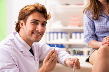 Fototapeta premium Male doctor checking with sensory hammer